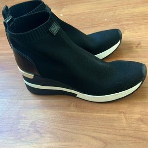 Brand new never worn Michael Kors wedge sneakers. Size 9.5